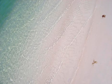 sands and blue waters of a tropical snady beach