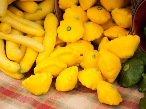 Sunburst squash for sale at a farmer's market.