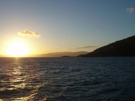 sunset sailing over the water