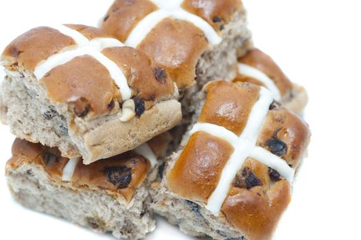 Fresh spicy batch of Easter Hot Cross Buns dotted with raisins and glazed with the symbolic cross