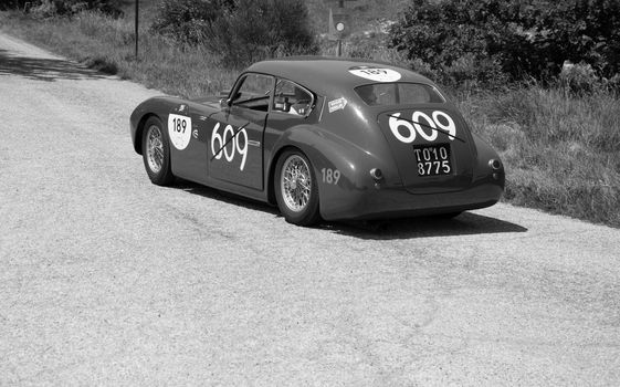 URBINO - ITALY - JUN 16 - 2022 : ERMINI 1100 BERLINETTA MOTTO 1950 on an old racing car in rally Mille Miglia 2022 the famous italian historical race (1927-1957