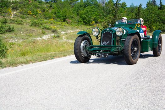 URBINO - ITALY - JUN 16 - 2022 : ALFA ROMEO 8C 2300 MONZA 1933 on an old racing car in rally Mille Miglia 2022 the famous italian historical race (1927-1957