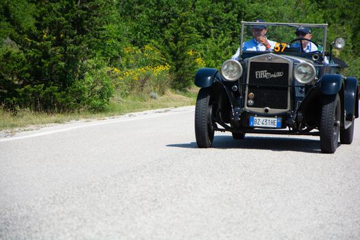 URBINO - ITALY - JUN 16 - 2022 : FIAT 520 1929 on an old racing car in rally Mille Miglia 2022 the famous italian historical race (1927-1957