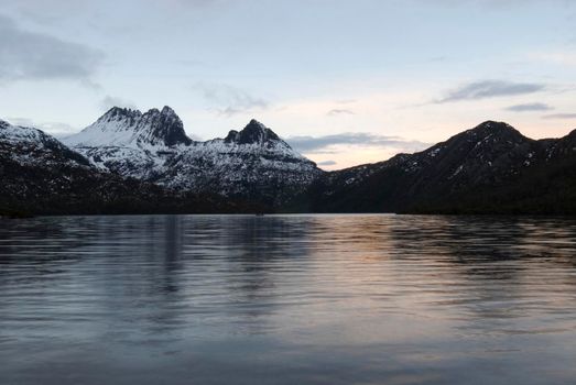 cradle and surrounding mountains framed with the waters of dove lake