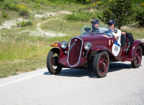 URBINO - ITALY - JUN 16 - 2022 : FIAT 508 S BALILLA COPPA D ORO 1934 on an old racing car in rally Mille Miglia 2022 the famous italian historical race (1927-1957