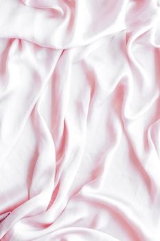 Elegant fabric texture, abstract backdrop and modern pastel colours concept - Pink soft silk waves, flatlay background