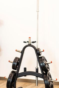 Close up shot of various gym equipment and weights.