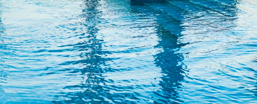 Shot of a blue water in the pool