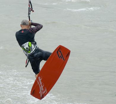 an airborne kite surfer