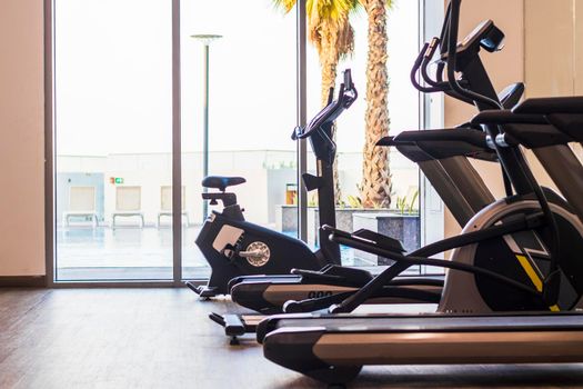 Close up shot of various gym equipment and weights.