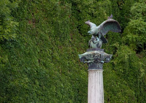 Turul statue on a column with a green background Budapest Gellert Hill, Hungary. High quality photo