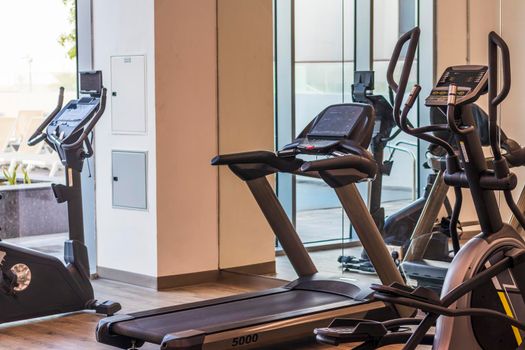 Close up shot of various gym equipment and weights.