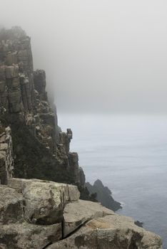 spectacular rugged coastline of cape pillar pictured on a misty day
