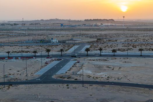 Shot of a sunrise over empty area of the city