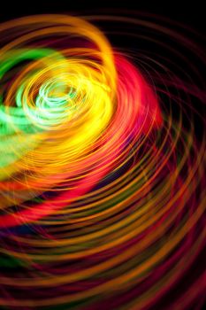 a vivid and flamboyant image featuring colorful spiraling lines of multicloured lights