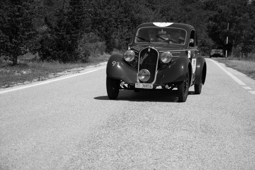 URBINO - ITALY - JUN 16 - 2022 : FIAT 508 S MM BALILLA BERLINETTA AERODINAMICA 1935 on an old racing car in rally Mille Miglia 2022 the famous italian historical race (1927-1957