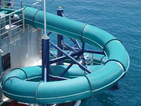fun in the water, a blue snakeing waterchute