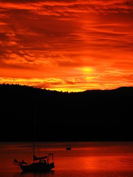 a bright flame red sky at sunset