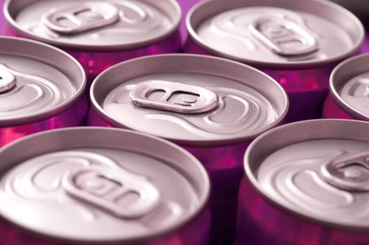 angled view of the tops of unopened drinks cans