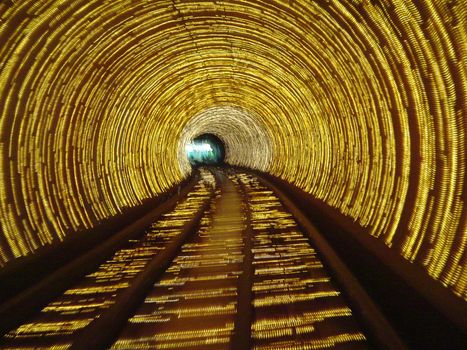 Architecture background with an interior view of a circular subway tunnel showing the concentric structure disappearing into the distance