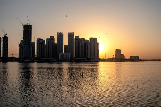 Sunrise in Jadaf area of Dubai, view of Dubai creek Harbor construction of which is partially completed. Outdoors