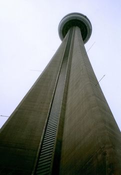 CN Tower from low angle against grey sky, Toronto, Canada