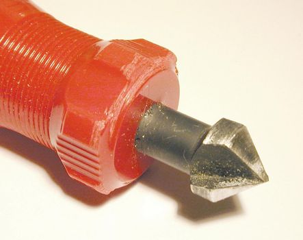 Detail of the bit of a hand countersink tool for woodworking to enable screws to be mounted flush in the wood by making a conical recess