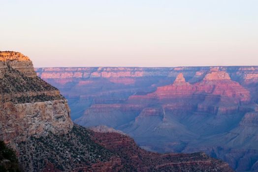 beautiful red and ornage layers lit by the setting sun over the grand canyon