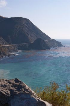 concrete arch bridges tower over big creek on the big sur coast, california