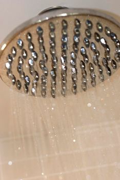 water droplets running from a large shower head