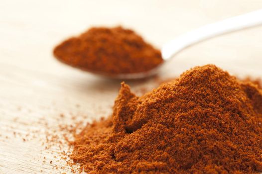 Close up on a heap of pimenton spice or smoked Spanish ground sweet red pepper
