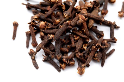 Whole cloves, or dried flower buds, a seasoning used in cooking with a pungent strong flavour so it is used sparingly or ground into powder