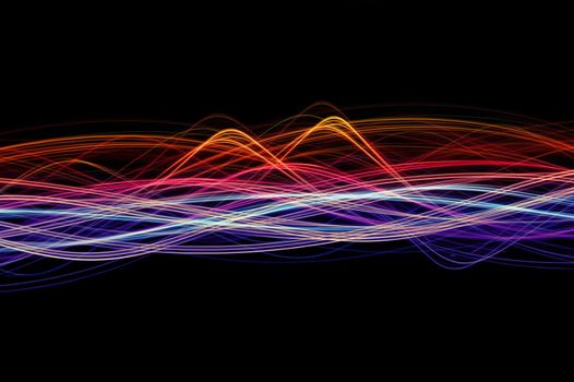 an abstract background image featuring colourful waves of light