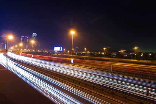 Dubai, UAE - 06.04.2021 Light trails on Al Khail road at night