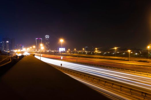 Dubai, UAE - 06.04.2021 Light trails on Al Khail road at night