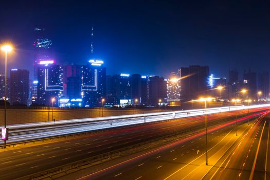 Dubai, UAE - 06.04.2021 Light trails on Al Khail road at night