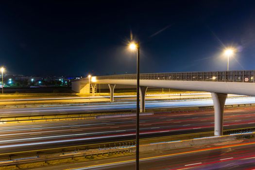 Light trails on busy night road.