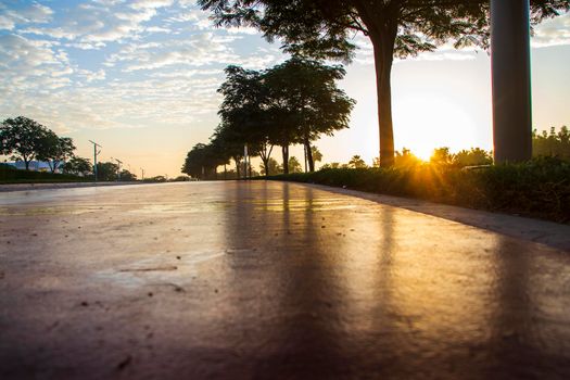Jogging and cycling tracks in Al Warqa park, Dubai, UAE early in the morning. Lamp post powered by solar panels can be seen in the picture. Outdoors