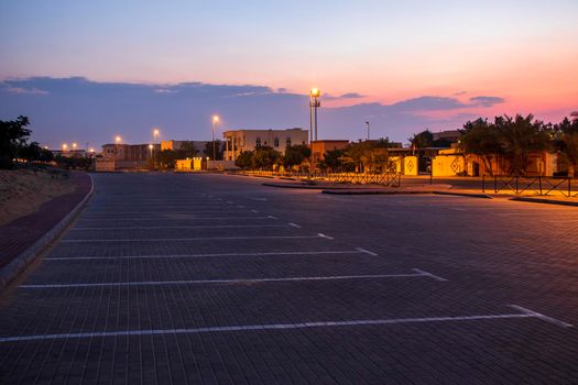 Early morning hour at outdoor parking lot.