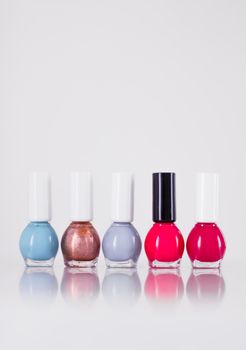 Beauty, make-up and cosmetics concept - Nail polish bottles, manicure and pedicure collection