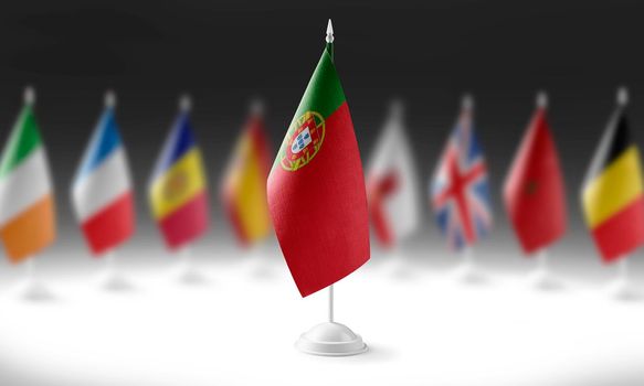 The national flag of the Portugal on the background of flags of other countries.