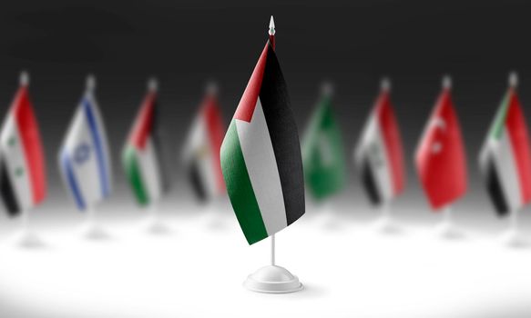 The national flag of the Palestine on the background of flags of other countries.