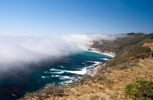 a layer of mist over the bigsur coast line