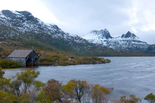 iconic view of dove lake and the boat shed with cradle mountain in the background, Cradle Mountain-Lake St Clair National Park