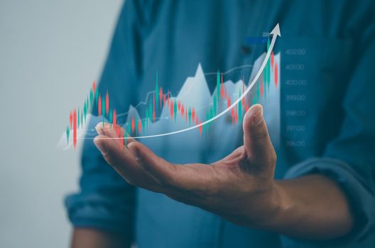 Stock and crypto investment funds.Finance and business investment concept. Businessman analyzing or trading Forex graphs of financial data candlestick chart.