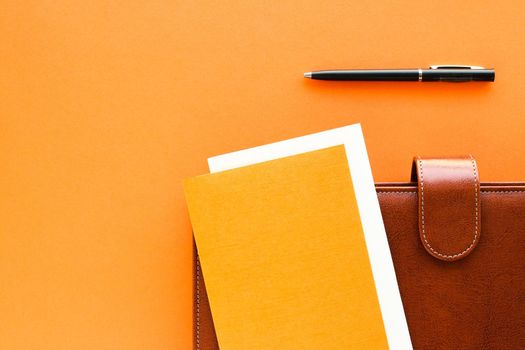 Modern workspace, productivity and corporate lifestyle concept - Luxury business brown brief-case on the office table desk, flatlay