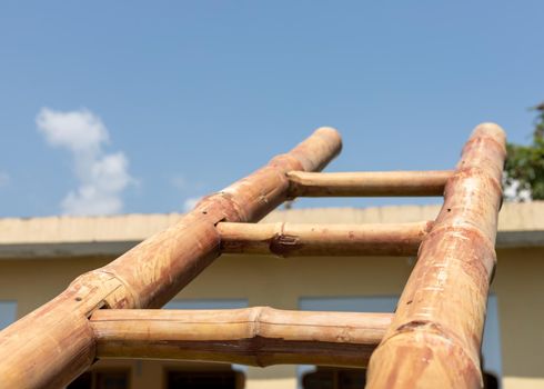 Ladder pointing to the blue sky with copy space