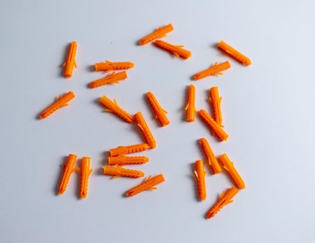Plastic anchors or orange color dowel pin