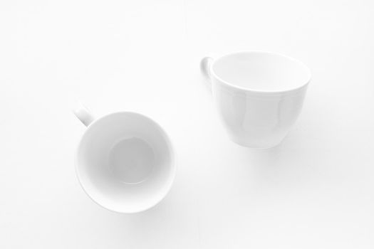 Kitchen, dishware design and drink concept - Empty cup and saucer mockup on white background, flatlay