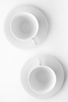 Kitchen, dishware design and drink concept - Empty cup and saucer mockup on white background, flatlay